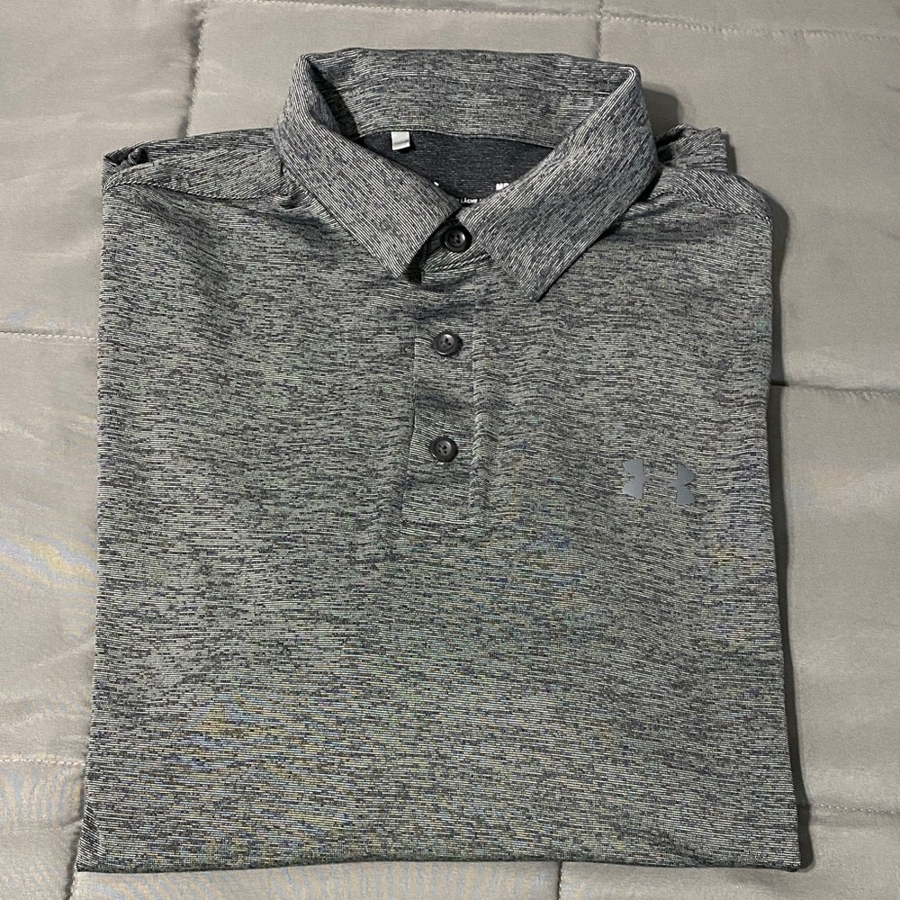 Under Armour long sleeved button down polo. Size M